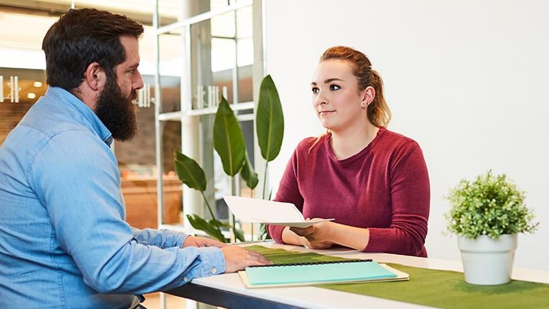 People discussing documents